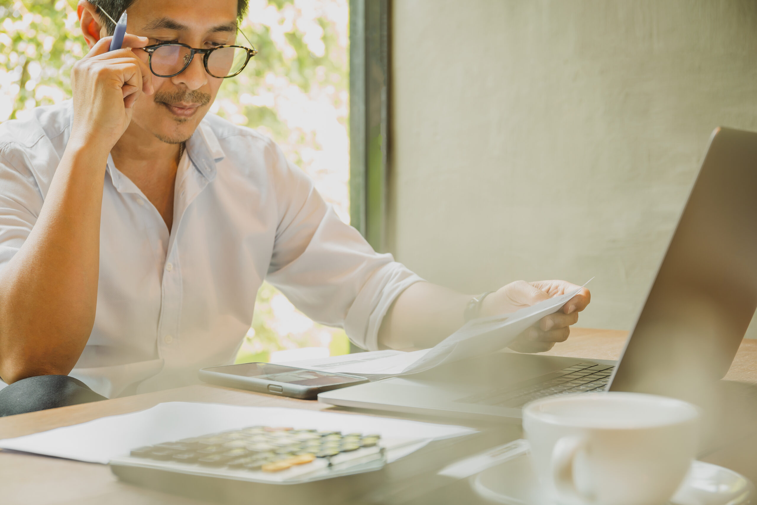 Entrepreneur is looking at papers.